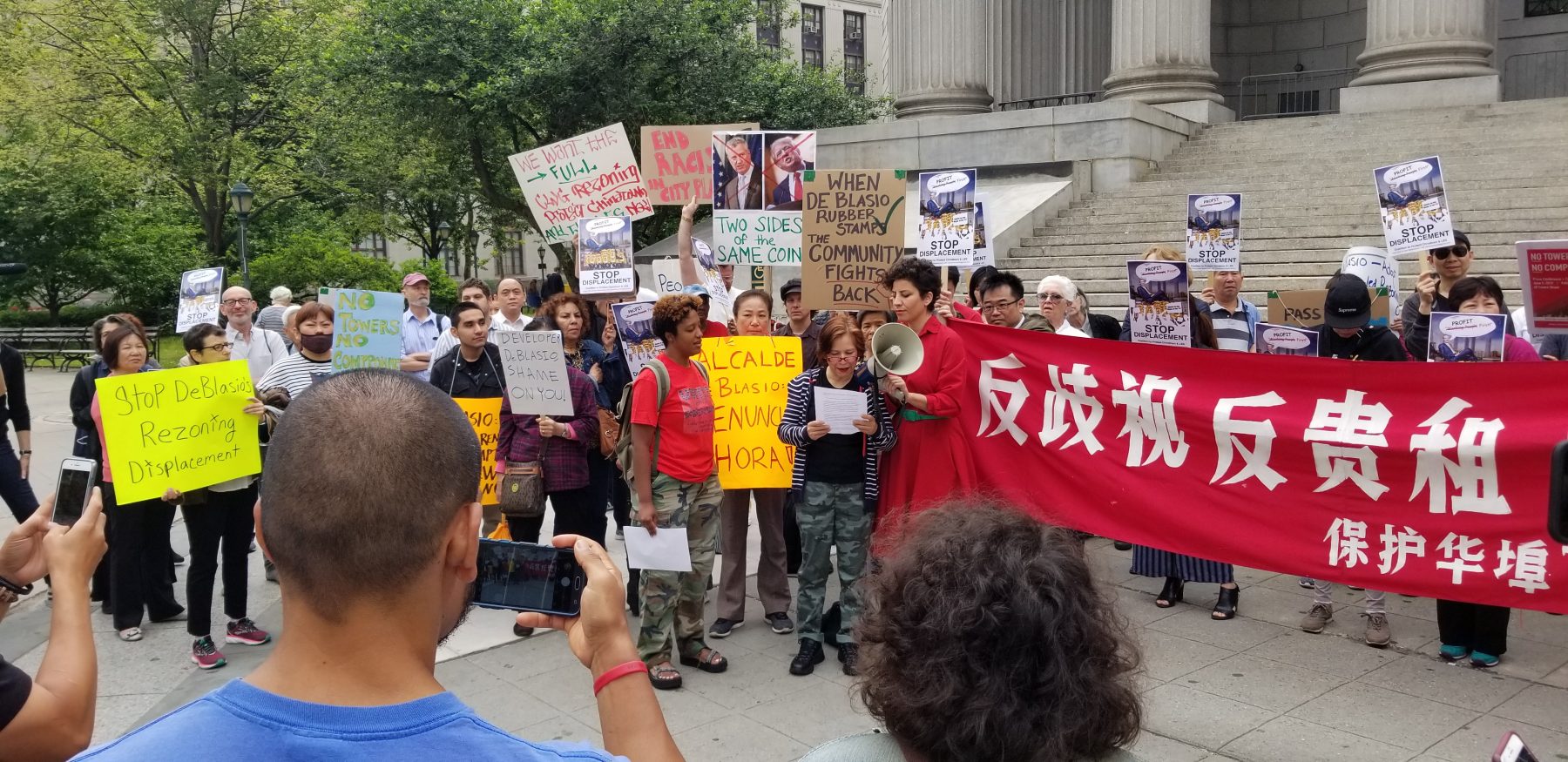 Members of the Chinatown Working Group gather for a press conference in support of the Lower East Side Organized Neighbors (LESON).